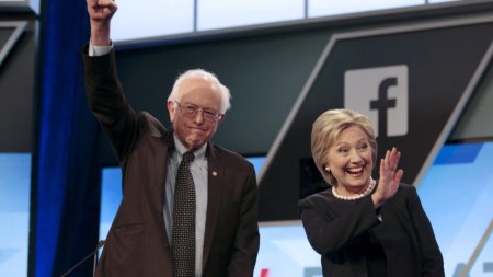 Democratic U.S. presidential candidates Senator Bernie Sanders and Hillary Clinton wave before the start of the Univision News and Washington Post Democratic U.S. presidential candidates debate in Kendall, Florida, March 9, 2016. REUTERS/Javier Galeano TPX IMAGES OF THE DAY - RTSA423