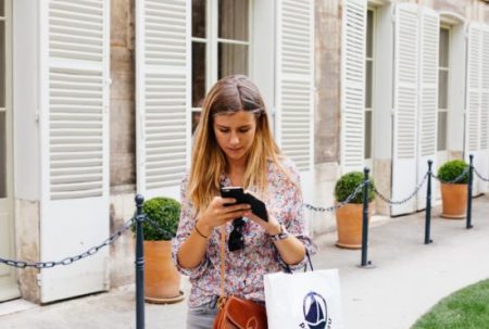 young-woman-with-iphone-1-550x370